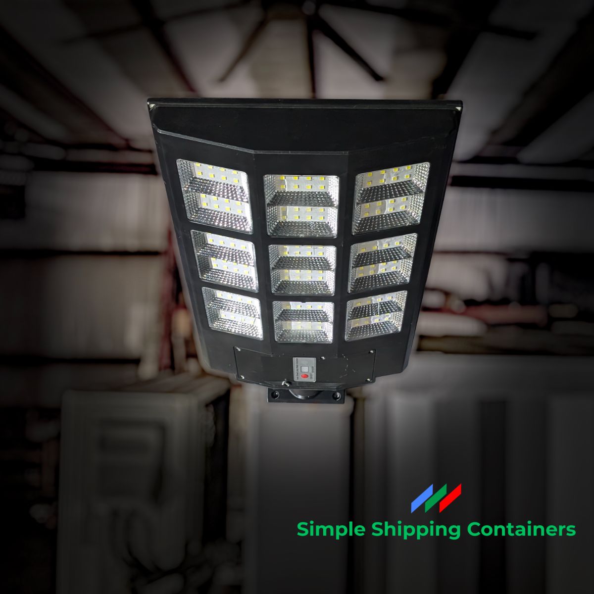 A solar-powered corner casting light designed for shipping containers, featuring multiple LED panels and a durable black frame.