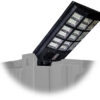 Large LED solar-powered street lamp mounted to a shipping container corner casting, IP68 waterproof outdoor lighting solution.